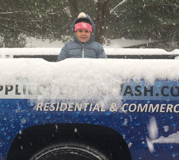 Snow Plowing Services - A snow plowing vehicle in action, highlighting our professional snow plowing services.